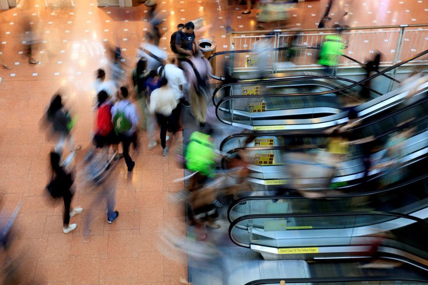 A blurry shot of customers accessing an escalator