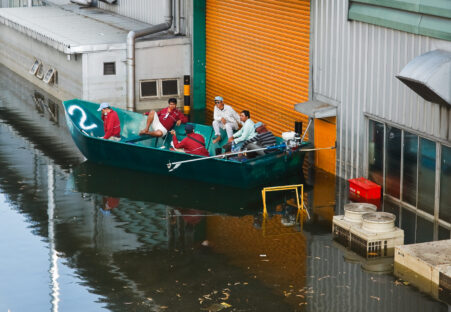 Men in a boat during a flood