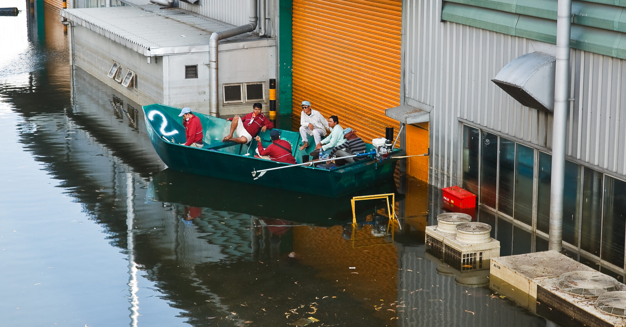 Men in a boat during a flood