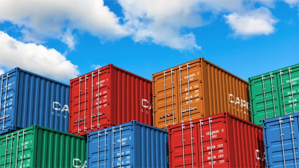 Stacked cargo containers in port.
