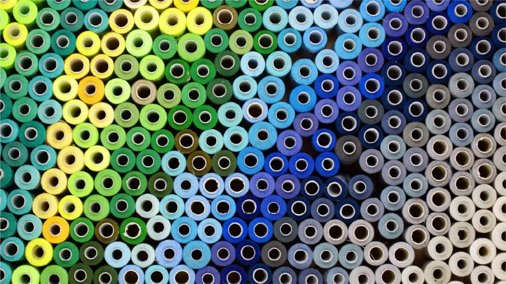 Colourful reels of cotton thread.